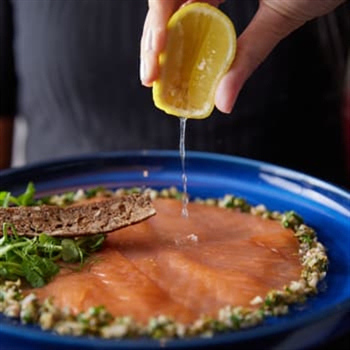 Royal Horseguards Hotel Bottomless Brunch for Two - Drizzling Lemon over Salmon Royal Horseguards Hotel Bottomless Brunch for Two - Drizzling Lemon over Salmon
